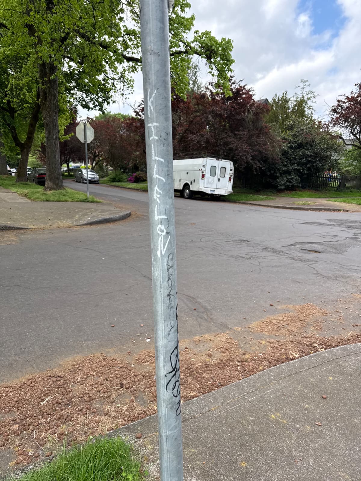 Graffiti on metal street pole